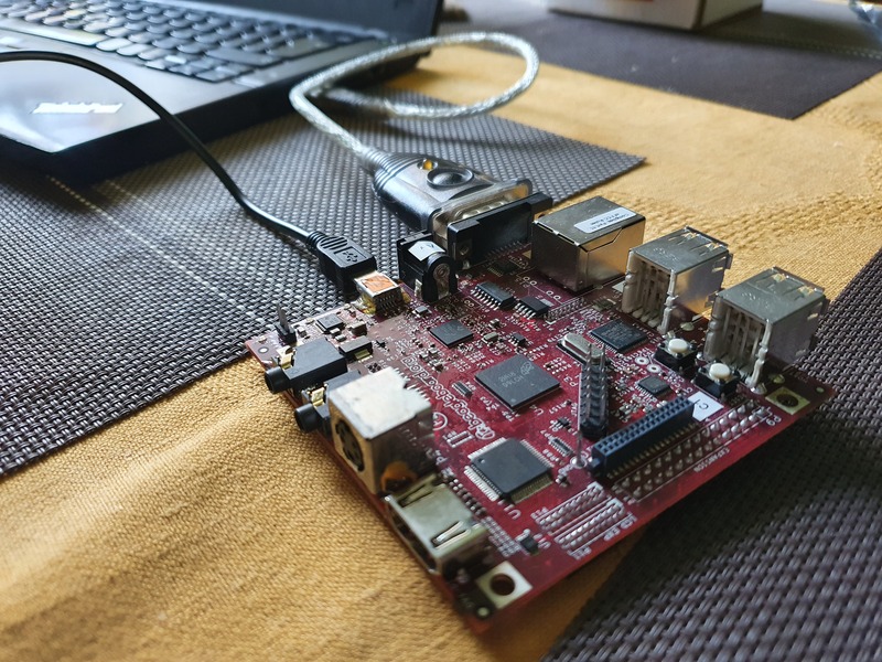 BeagleBoard-xM connected to laptop via USB-serial cable and powered from the same laptop via USB-miniUSB cable